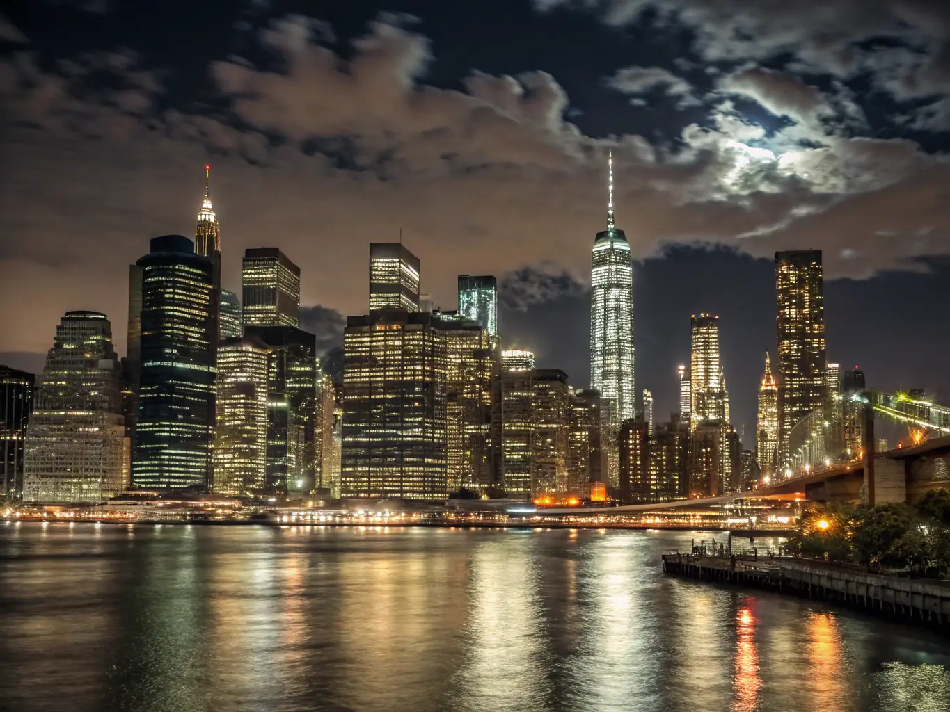A photograph of the Manhattan skyline at dusk, emphasizing the density of buildings and the vibrant city lights, symbolizing the investment opportunities available.