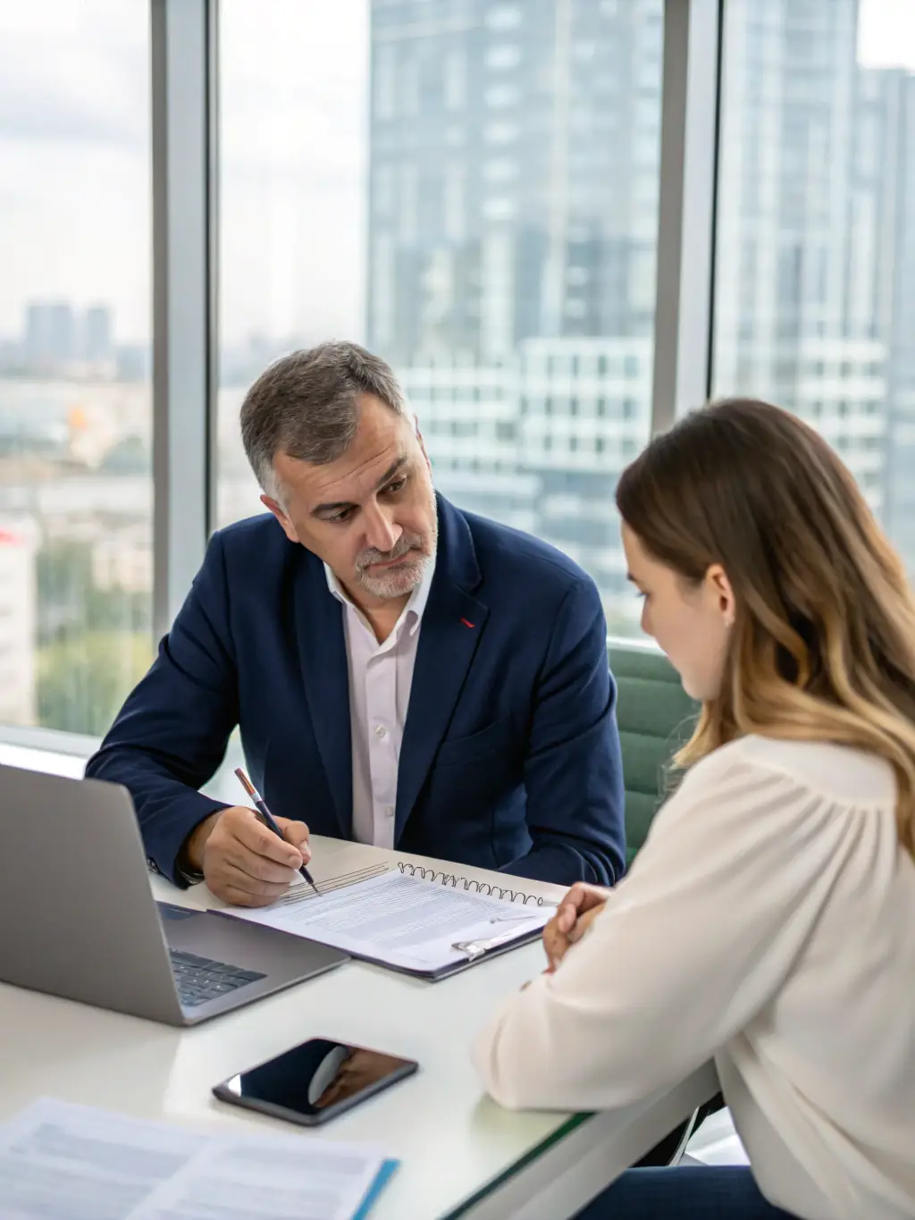 An insurance agent explaining different insurance policies to a client in a virtual meeting, highlighting key benefits and coverage options.