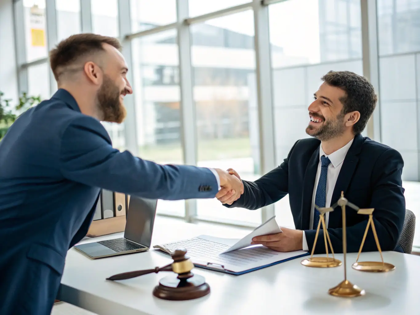 A professional lawyer shaking hands with a new client in a modern law office, symbolizing successful client acquisition through optimized intake processes.