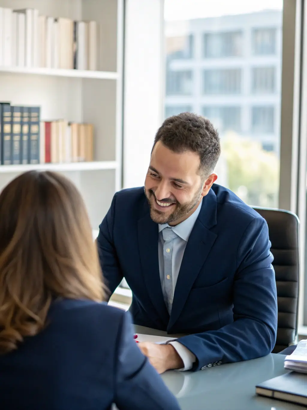 A professional headshot of a probate attorney, smiling confidently in a modern office setting, symbolizing legal expertise and partnership.